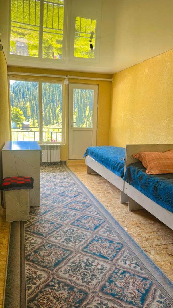 Photo of a shared room with two separate beds
